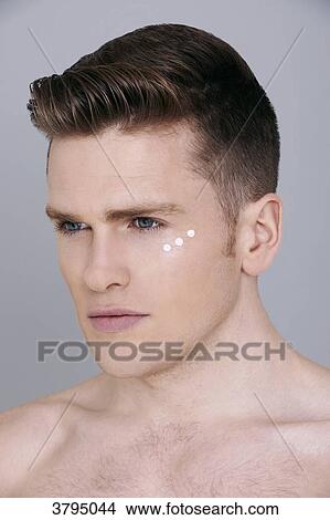 topless man, looking away, serious, dots of eye cream around the eye View Large Photo Image Picture - topless man, looking away, serious, dots of eye cream around the eye. Fotosearch