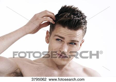 topless man, looking in the mirror, looking at his hair, hands in his hair, fixing his hair, View Large Photo Image Stock Image - topless man, looking in the mirror, looking at his hair, hands in his hair, fixing his hair,. Fotosearch