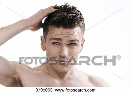 topless man, looking in the mirror, looking at his hair, hands in his hair, fixing his hair, View Large Photo Image Stock Image - topless man, looking in the mirror, looking at his hair, hands in his hair, fixing his hair,. Fotosearch