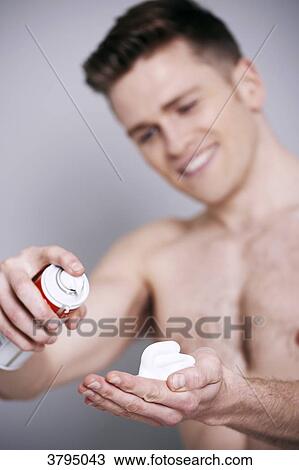 topless man, shaving cream in his hand, smiling, looking at the shaving cream View Large Photo Image Stock Image - topless man, shaving cream in his hand, smiling, looking at the shaving cream. Fotosearch