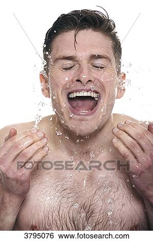 topless man, splashing water onto his face, eyes closed, mouth opened, smiling View Large Photo Image Stock Photograph - topless man, splashing water onto his face, eyes closed, mouth opened, smiling. Fotosearch
