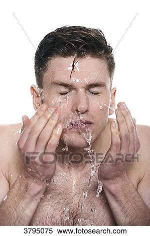 topless man, splashing water onto his face, eyes closed View Large Photo Image Stock Photography - topless man, splashing water onto his face, eyes closed. Fotosearch