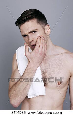 topless man, towel on his shoulder, hand on his face, mouth opened View Large Photo Image Stock Photograph - topless man, towel on his shoulder, hand on his face, mouth opened. Fotosearch