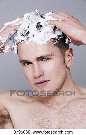 topless man, with shampoo in his hair, looking at camera, serious, washing his hair, with foam on his head View Large Photo Image Stock Photo - topless man, with shampoo in his hair, looking at camera, serious, washing his hair, with foam on his head. Fotosearch