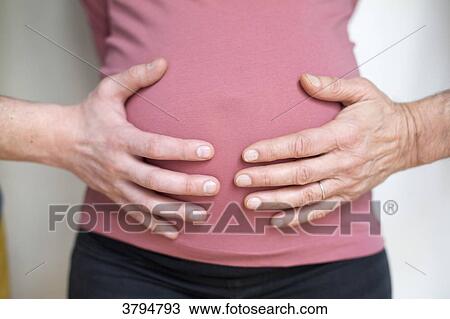 Two hands of different people on the belly of a pregnant woman. View Large Photo Image Stock Image - Two hands of different people on the belly of a pregnant woman.. Fotosearch
