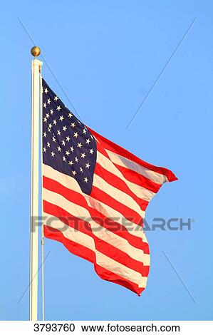 US flag in blue sky. View Large Photo Image Stock Image - US flag in blue sky.. Fotosearch