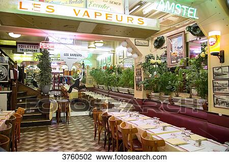 Stock Image - View of setting up of restaurant les Vapeurs to Trouvilles.. Fotosearch
