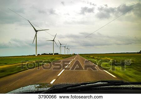 Wind turbines in the fields View Large Photo Image Stock Photograph - Wind turbines in the fields. Fotosearch