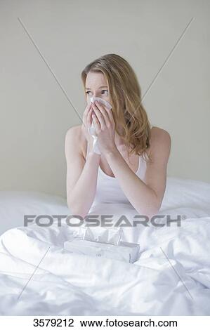 Woman sick with handkerschiefs in bed View Large Photo Image Stock Image - Woman sick with handkerschiefs in bed. Fotosearch