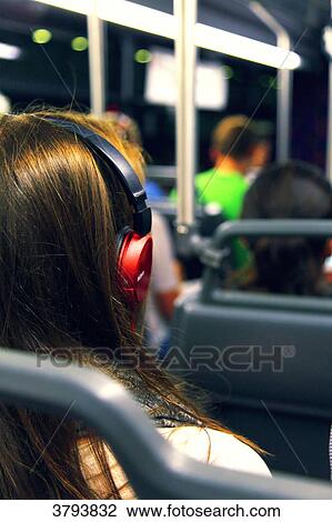Woman with headphones in night bus. View Large Photo Image Stock Image - Woman with headphones in night bus.. Fotosearch