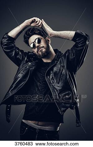 Stock Image - Young Hipster leather jacket, Hairdo. Fotosearch