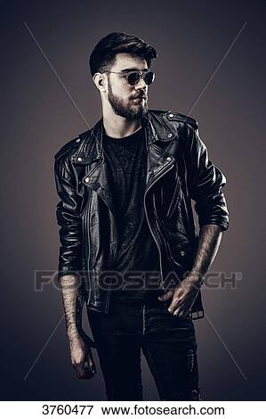 Young Hipster leather jacket, looks to the side View Large Photo Image Stock Photo - Young Hipster leather jacket, looks to the side. Fotosearch