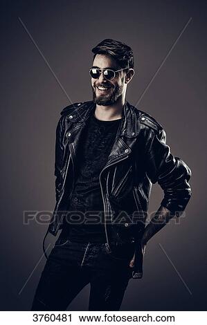 Young Hipster leather jacket, smiles, hands in back pockets View Large Photo Image Stock Image - Young Hipster leather jacket, smiles, hands in back pockets. Fotosearch