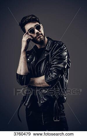 Young Hipster leather jacket, thinking, hand on cheek View Large Photo Image Stock Photo - Young Hipster leather jacket, thinking, hand on cheek. Fotosearch