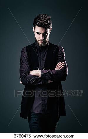 Young Hipster shirt and jacket, arms folded, looking at the camera View Large Photo Image Stock Photography - Young Hipster shirt and jacket, arms folded, looking at the camera. Fotosearch