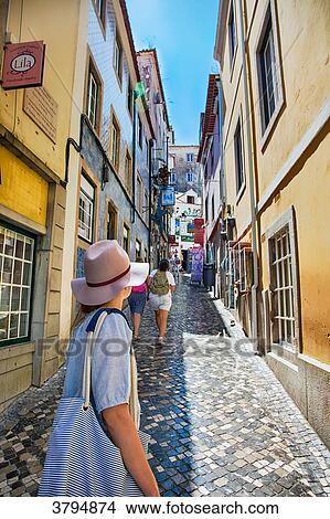 Young woman back looks to an alley in the town of Sintra, Lisbon area, Portugal View Large Photo Image Picture - Young woman back looks to an alley in the town of Sintra, Lisbon area, Portugal. Fotosearch