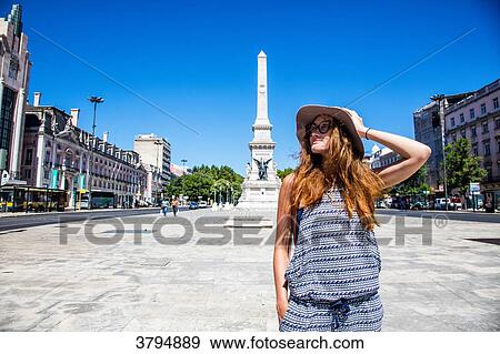 Young woman face, head to the side, posing in front of the obelisk of victory and independence, instead of restaurants, Lisbon, Portugal View Large Photo Image Stock Photo - Young woman face, head to the side, posing in front of the obelisk of victory and independence, instead of restaurants, Lisbon, Portugal. Fotosearch