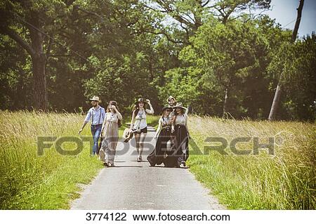 Youth group Hipster face, walking on the country road View Large Photo Image Stock Image - Youth group Hipster face, walking on the country road. Fotosearch