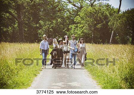 Youth group Hipster face, walking on the country road View Large Photo Image Stock Photography - Youth group Hipster face, walking on the country road. Fotosearch