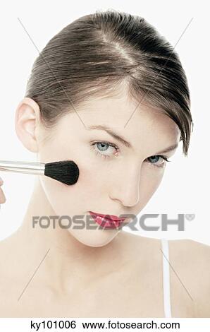 Young Woman face making-up with a brush, close-up (studio) View Large Photo Image Stock Photograph - Young Woman face making-up with a brush, close-up (studio). Fotosearch