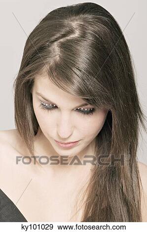 Young Woman face with make up, bended head, strasses on her eyelids (studio) View Large Photo Image Stock Photo - Young Woman face with make up, bended head, strasses on her eyelids (studio). Fotosearch