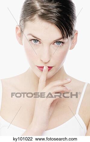 Young Woman face with make up, having her hand in front of her mouth, close-up (studio) View Large Photo Image Stock Image - Young Woman face with make up, having her hand in front of her mouth, close-up (studio). Fotosearch