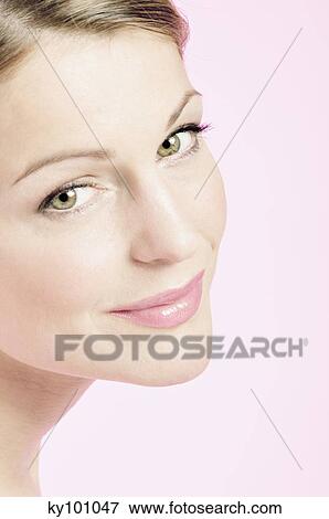 Young Woman face with make up, looking at the camera, close-up (studio) View Large Photo Image Stock Photo - Young Woman face with make up, looking at the camera, close-up (studio). Fotosearch