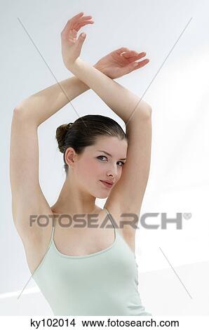 Woman with her arms in the air View Large Photo Image Picture - Woman with her arms in the air. Fotosearch
