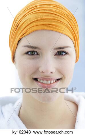 Young Woman with headband looking at the camera, smiling, inside, close up View Large Photo Image Stock Image - Young Woman with headband looking at the camera, smiling, inside, close up. Fotosearch