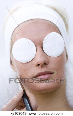 WPortrait of a young woman with beauty mask on her face and cleansing cotton on her eyes View Large Photo Image Stock Photo - WPortrait of a young woman with beauty mask on her face and cleansing cotton on her eyes. Fotosearch
