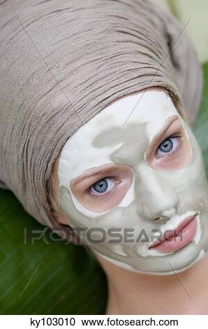 Young Woman face with beauty mask View Large Photo Image Stock Image - Young Woman face with beauty mask. Fotosearch