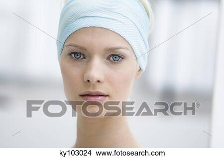 Young Woman face with make up, looking at the camera, close-up (studio) View Large Photo Image Picture - Young Woman face with make up, looking at the camera, close-up (studio). Fotosearch