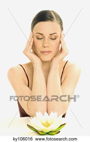 Portrait of a woman in zen attitude, shut eyes, water lily (studio) View Large Photo Image Stock Photograph - Portrait of a woman in zen attitude, shut eyes, water lily (studio). Fotosearch