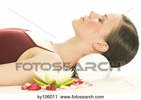 Portrait of a woman relaxing, lying on floor, shut eyes, water lily View Large Photo Image Stock Image - Portrait of a woman relaxing, lying on floor, shut eyes, water lily. Fotosearch