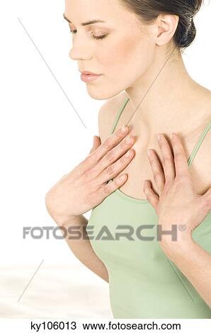 Portrait of a young woman in zen attitude, putting her hands on collar bones View Large Photo Image Stock Image - Portrait of a young woman in zen attitude, putting her hands on collar bones. Fotosearch
