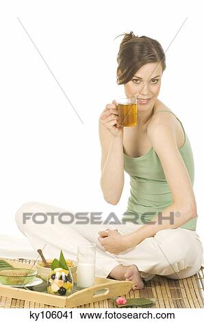 Woman drinking tea View Large Photo Image Stock Image - Woman drinking tea. Fotosearch