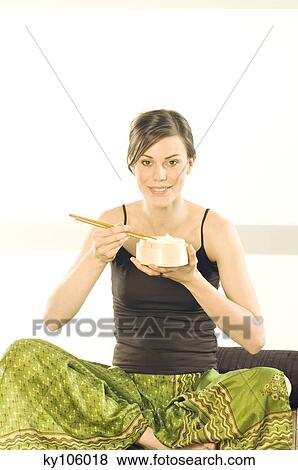 Woman eating pasta View Large Photo Image Stock Photo - Woman eating pasta. Fotosearch