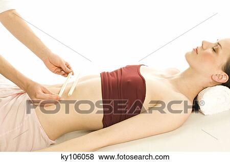 Woman having belly massaged View Large Photo Image Stock Photo - Woman having belly massaged. Fotosearch