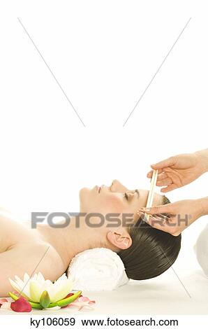 Woman having front massaged, water lily View Large Photo Image Stock Photo - Woman having front massaged, water lily. Fotosearch