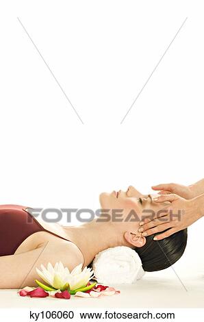 Woman having head massaged, water lily View Large Photo Image Stock Image - Woman having head massaged, water lily. Fotosearch