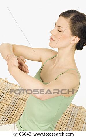 Woman meditating, shut eyes, tight hands View Large Photo Image Stock Image - Woman meditating, shut eyes, tight hands. Fotosearch