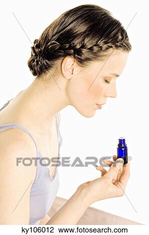 Stock Image - Woman with essential oil. Fotosearch