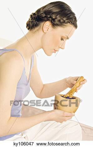 Woman with pestle and mortar View Large Photo Image Stock Photo - Woman with pestle and mortar. Fotosearch