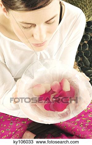 Young woman holding flower petals in a little dish, view from above View Large Photo Image Stock Image - Young woman holding flower petals in a little dish, view from above. Fotosearch