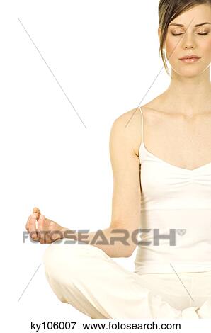 Young woman sitting, yoga attitude, shut eyes, close up View Large Photo Image Stock Photo - Young woman sitting, yoga attitude, shut eyes, close up. Fotosearch