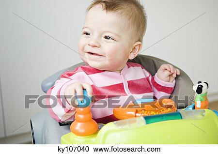 Baby in baby-walker View Large Photo Image Stock Image - Baby in baby-walker. Fotosearch