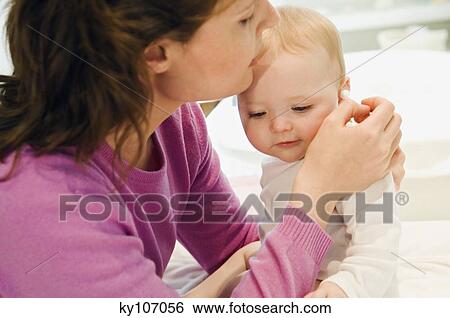 Mother and baby, ears care View Large Photo Image Stock Photograph - Mother and baby, ears care. Fotosearch