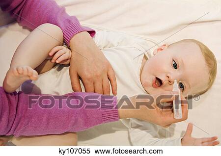 Mother and baby, eyes care View Large Photo Image Stock Photography - Mother and baby, eyes care. Fotosearch