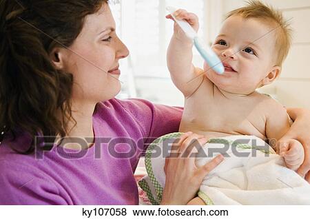 Mother and baby in bathroom View Large Photo Image Stock Photo - Mother and baby in bathroom. Fotosearch
