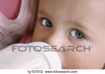 Mother bootle-feeding her baby, close up View Large Photo Image Stock Image - Mother bootle-feeding her baby, close up. Fotosearch
